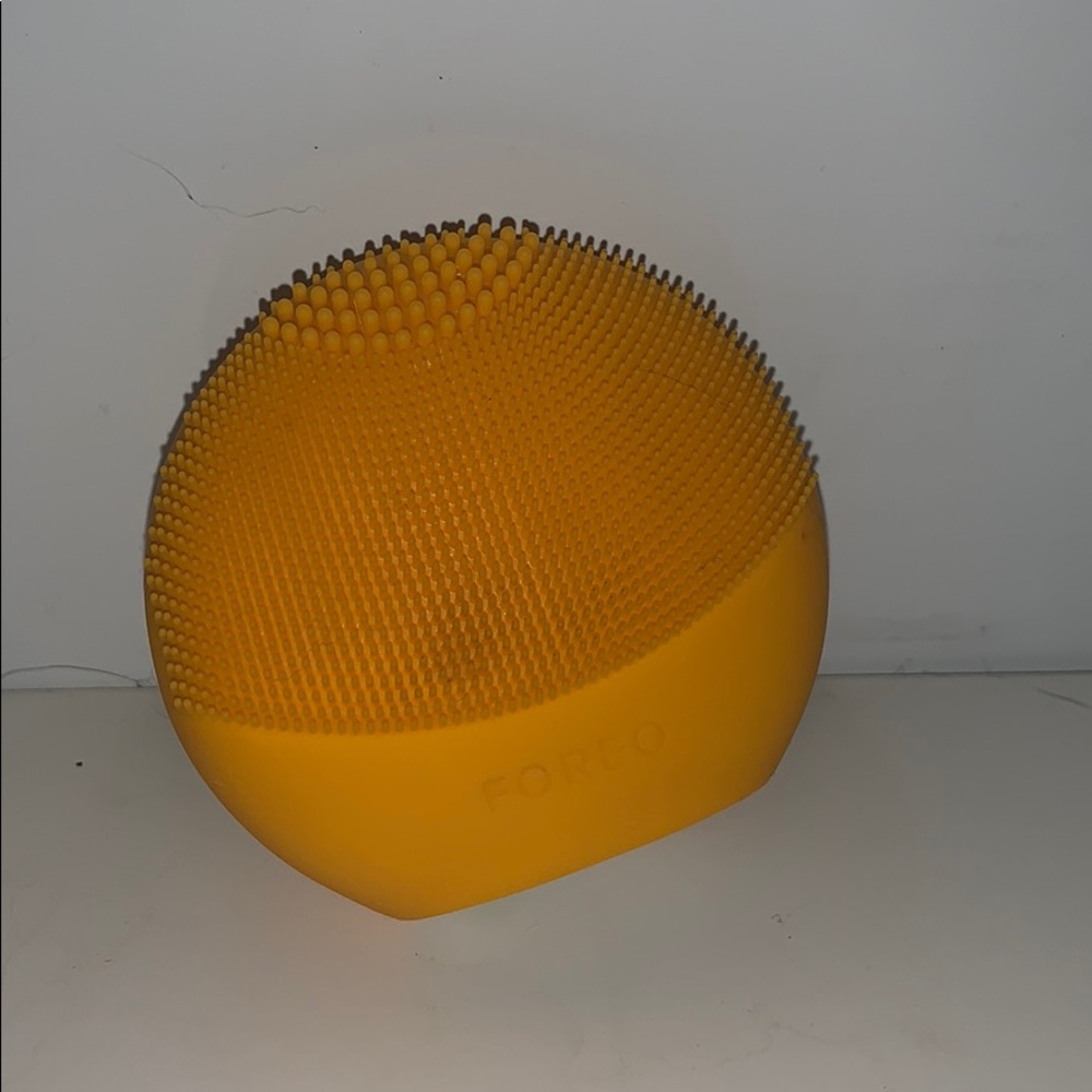 Orange foreo facial cleanser